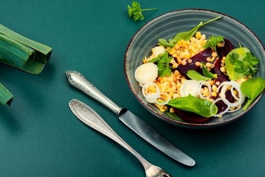 Healthy vegan salad with boiled beets, lentils, leek and herbs. Low calorie salad.