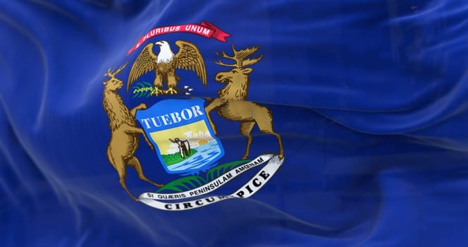 Detail of Michigan state flag waving. Dark blue flag with state coat of arms featuring an eagle, an elk and a moose. 3d illustration render. Selective focus. Close-up.