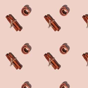 Seamless endless pattern of cinnamon with hard shadows isolated on light pink background. Top view
