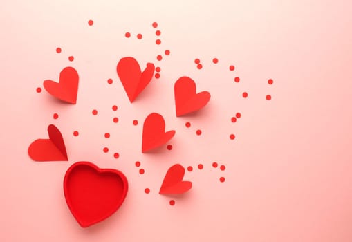 Red heart shapes on a pink background, Wedding or Valentines Day concept, love symbol