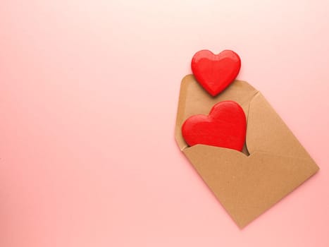 Red heart shapes on a pink background, Wedding or Valentines Day concept, love symbol