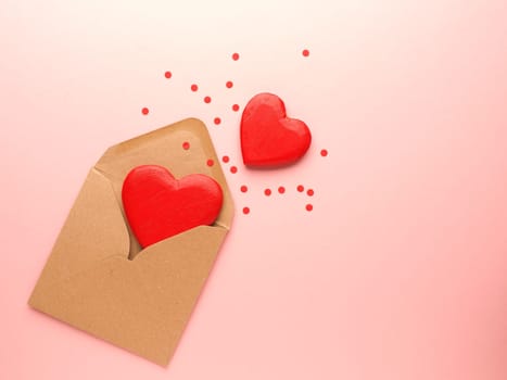 Red heart shapes on a pink background, Wedding or Valentines Day concept, love symbol