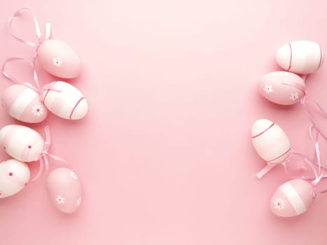 pink Easter eggs on a pink background with space for text