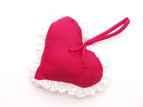 Red fabric heart shape, love symbol, close up studio shot, Valentines Day or wedding object