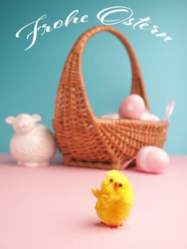 Close up of a cute chick with the German words Happy Easter and an Easter egg background