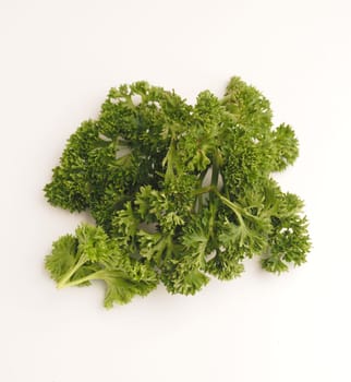 Tasty curly parsley on a white background, healthy food, spicy ingredients