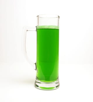 Glass of green beer on a bright background , Happy St Patricks Day