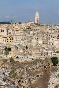 Panoramic view of Sassi di Matera a historic district in the city of Matera, well-known for their ancient cave dwellings from the Belvedere di Murgia Timone,  Basilicata, Italy