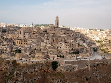 Panoramic view of Sassi di Matera a historic district in the city of Matera, well-known for their ancient cave dwellings from the Belvedere di Murgia Timone,  Basilicata, Italy