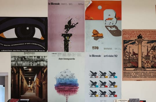 Venice, Italy - September 6, 2022:  59th Venice Art Biennale in Venice. Old posters advertising the Venice Biennale presented in the central pavilion in Giardini