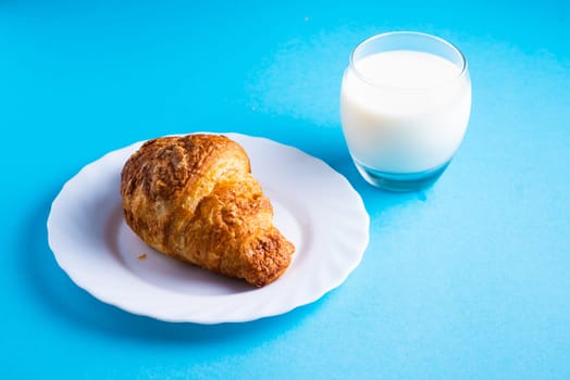 Wheat bread breakfast and milk in a morning, croissant, plate