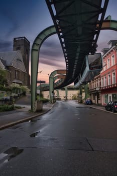 Low angle shot of a suspension railroad over Wuppertal's street in Germany