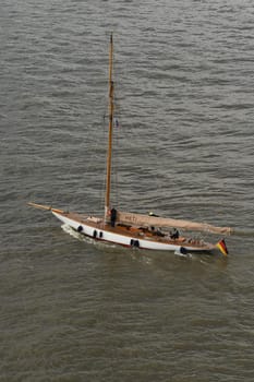 A closeup shot of a wooden sailing boat swimming on shallow waters