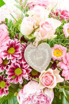 Colorful summer flowers in a bouquet with gift-awepers