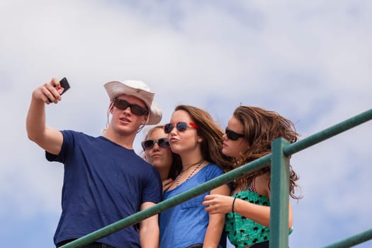 Teenagers at beach holidays talk laughter swimming sea ocean waves