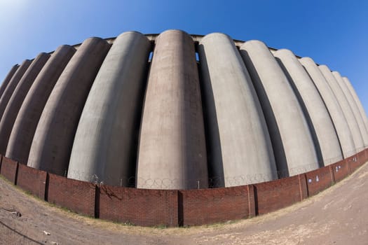 Farming harvested grain silos concrete structure closeup curved detail