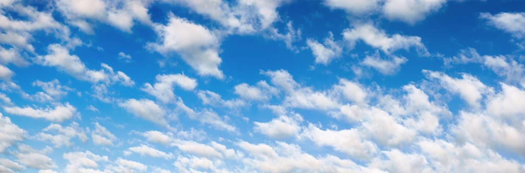 Panorama of a nice blue sky with fluffy white clouds,well suited as a background
