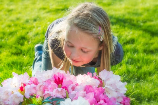 a girl smells of beautiful flowers