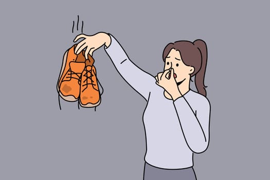 Woman hold in hands smell disgusting dirty shoes. Disgusted girl cover nose repelled with smelly footwear. Vector illustration.