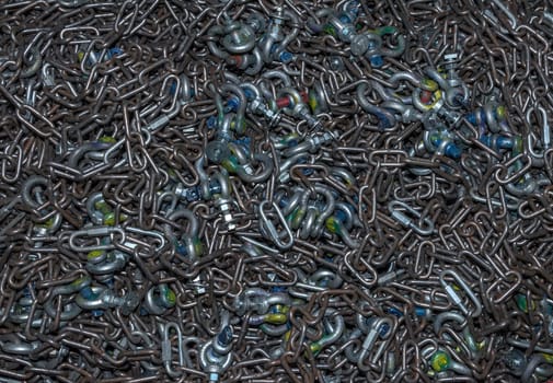 many different types of used iron shackles