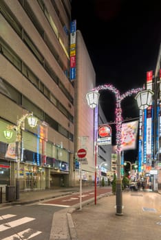 ikebukuro, japan - december 31 2019: Night view of the Sunshine Street at the east exit of Ikebukuro train station with restaurants and shops illuminated for christmas and new year celebrations.