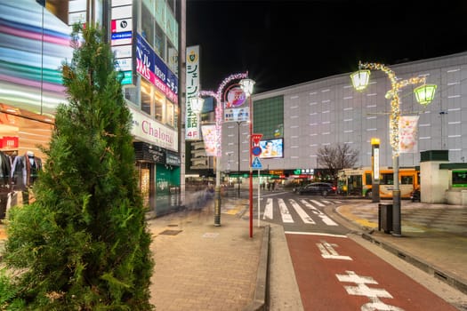ikebukuro, japan - december 31 2019: Night view of the Sunshine Street at the east exit of Ikebukuro train station with restaurants and shops illuminated for christmas and new year celebrations.