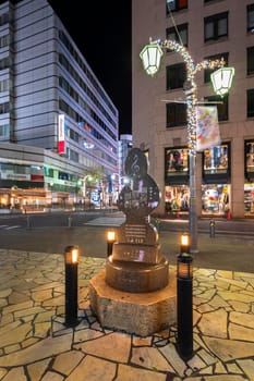ikebukuro, japan - december 31 2019: Public monument shaped in treble clef with the lyrics of love song "To Toshima Future"" dedicated to Toshima citizens by Sada Masashi on Sunshine Street at night."