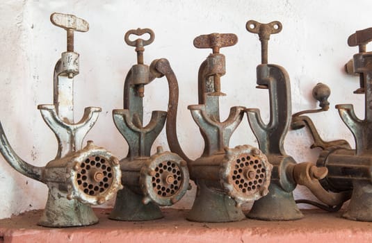 Old manual mincers used during traditional home slaughtering. Country style background