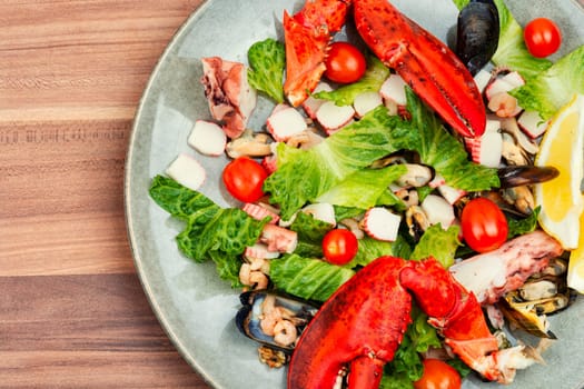 Mix of salad with oysters, mussels, lobster and vegetables.