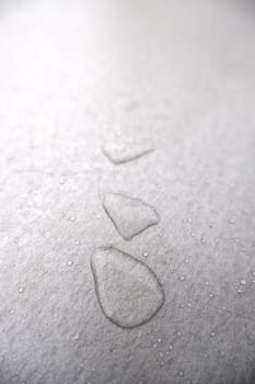 Detail of rainwater on a metal surface outdoors