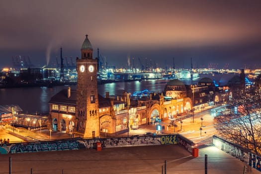 Illuminated St. Pauli Piers in Hamburg, the floating piers at Hamburg harbor, at night, Hamburg, Germany. St. Pauli contains a world-famous red-light district around the iconic Reeperbahn area.