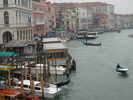 Venice, Italy, 02.22.2007. Venetian streets with graceful building facades. Grand Canal. Along the canal are Gothic and Renaissance palaces. Sights of Italy. Tourism business