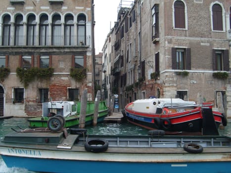 Venice, Italy, July 22, 2007. Venetian streets with graceful building facades. Grand Canal. Along the canal are Gothic and Renaissance palaces. Sights of Italy. Tourism business