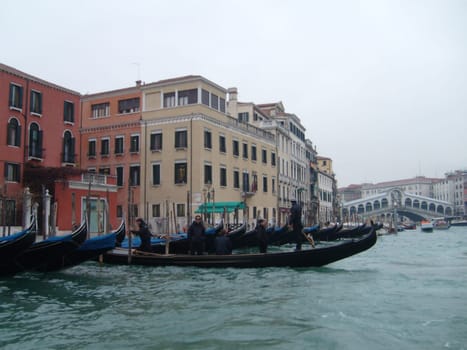 Venice, Italy, July 22, 2007. Venetian streets with graceful building facades. Grand Canal. Along the canal are Gothic and Renaissance palaces. Sights of Italy. Tourism business