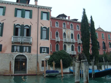 Venice, Italy, July 22, 2007. Venetian streets with graceful building facades. Grand Canal. Along the canal are Gothic and Renaissance palaces. Sights of Italy. Tourism business