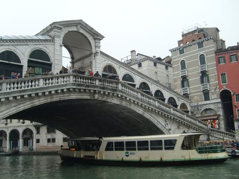 Venice, Italy, 02.22.2007. Venetian streets with graceful building facades. Grand Canal. Along the canal are Gothic and Renaissance palaces. Sights of Italy. Tourism business