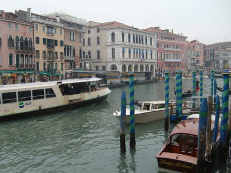 Venice, Italy, 02.22.2007. Venetian streets with graceful building facades. Grand Canal. Along the canal are Gothic and Renaissance palaces. Sights of Italy. Tourism business