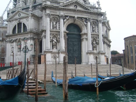 Venice, Italy, July 22, 2007. Venetian streets with graceful building facades. Grand Canal. Along the canal are Gothic and Renaissance palaces. Sights of Italy. Tourism business