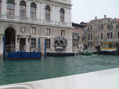 Venice, Italy, July 22, 2007. Venetian streets with graceful building facades. Grand Canal. Along the canal are Gothic and Renaissance palaces. Sights of Italy. Tourism business