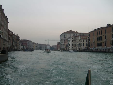 Venice, Italy, July 22, 2007. Venetian streets with graceful building facades. Grand Canal. Along the canal are Gothic and Renaissance palaces. Sights of Italy. Tourism business