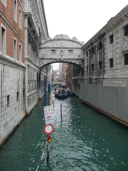 Venice, Italy, July 22, 2007. Venetian streets with graceful building facades. Grand Canal. Along the canal are Gothic and Renaissance palaces. Sights of Italy. Tourism business