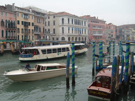 Venice, Italy, 02.22.2007. Venetian streets with graceful building facades. Grand Canal. Along the canal are Gothic and Renaissance palaces. Sights of Italy. Tourism business