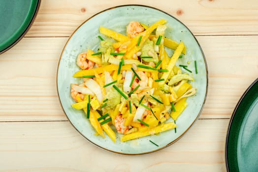 Delicious fresh salad with grilled prawns, mango, avocado and pine nuts. Copy space.