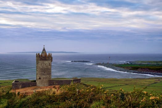 Amazing landscape of Doonagore castle and irish coastline  at Doolin, County Clare, Ireland