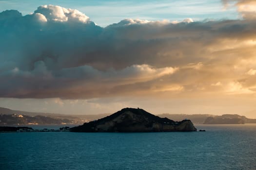 View from Procida island - magic sunrise with dramatic clouds.