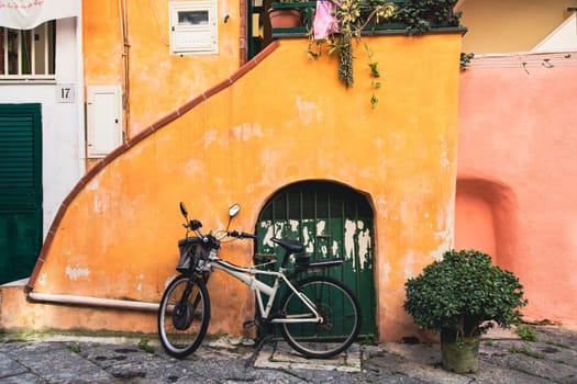 Procida island with colorful houses in small town street