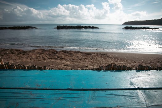 Wooden pier, exotic sea and a blue sky. Beautiful summer background. Vacation and traveling concept.