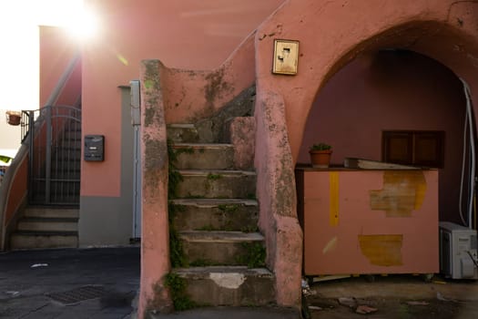 Procida island with colorful houses in small town street
