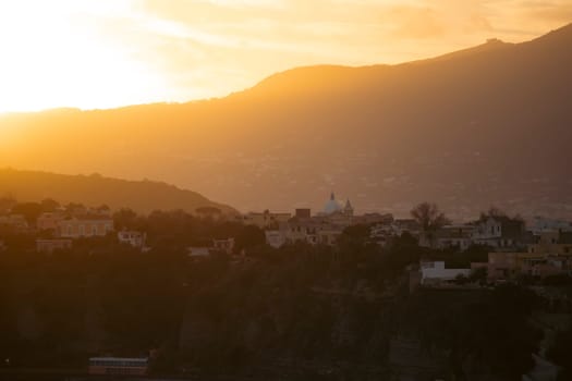 Magic sunset over Procida Island with Ischia island in the background.