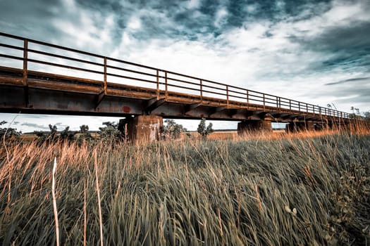 Former train line of the Darßbahn in Bresewitz, just before the Meiningen Bridge to the Fischland-Darß peninsula, Mecklenburg-West Pomerania, Germany